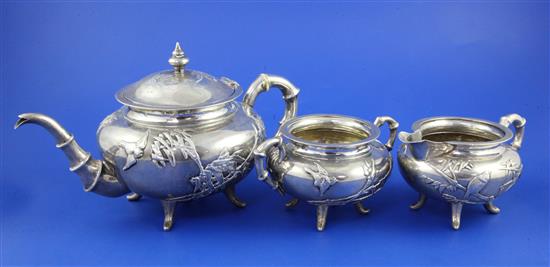 A late 19th/early 20th century Chinese Export three piece silver tea set by Wang Hing, Hong Kong, gross 31.5 oz.